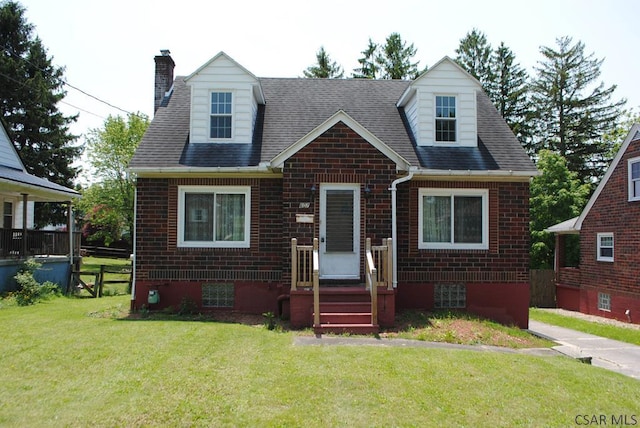 607 Belmont St, Johnstown, PA 15904 - new england style home with brick siding, a chimney, and roof with shingles