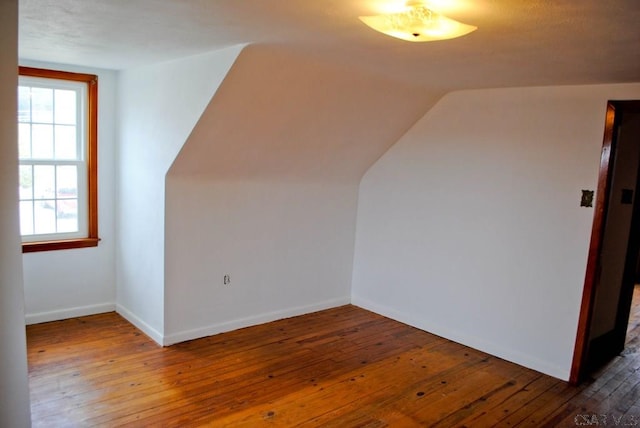 607 Belmont St, Johnstown, PA 15904 - additional living space featuring healthy amount of natural light, wood-type flooring, lofted ceiling, and baseboards