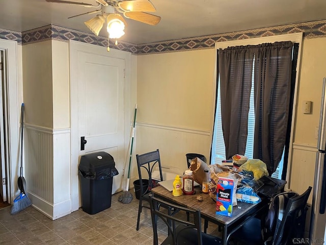 161 Stone St, Johnstown, PA 15906 - dining room featuring a wainscoted wall and a ceiling fan