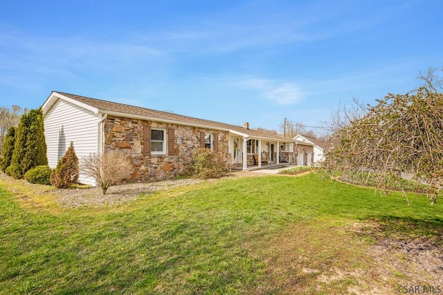 3313 Berlin Plank Rd, Berlin, PA 15530 - rear view of house with a chimney, stone siding, and a yard