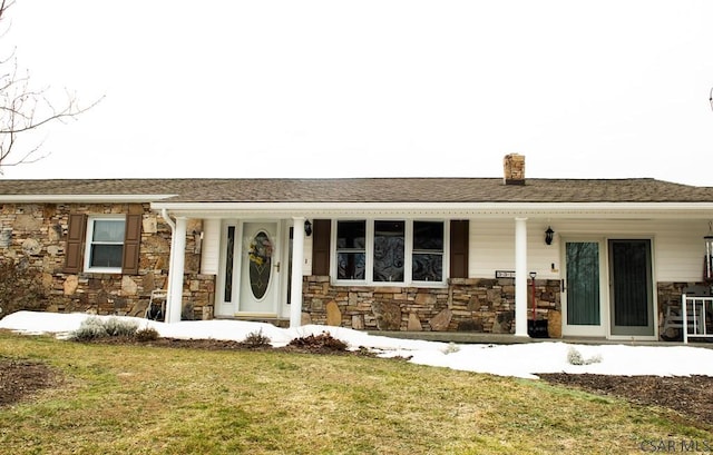 ranch-style home with a front lawn