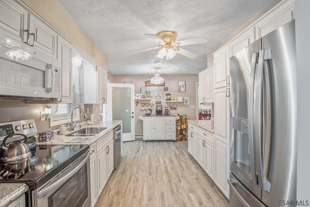 3313 Berlin Plank Rd, Berlin, PA 15530 - kitchen featuring a ceiling fan, appliances with stainless steel finishes, a sink, and a textured ceiling