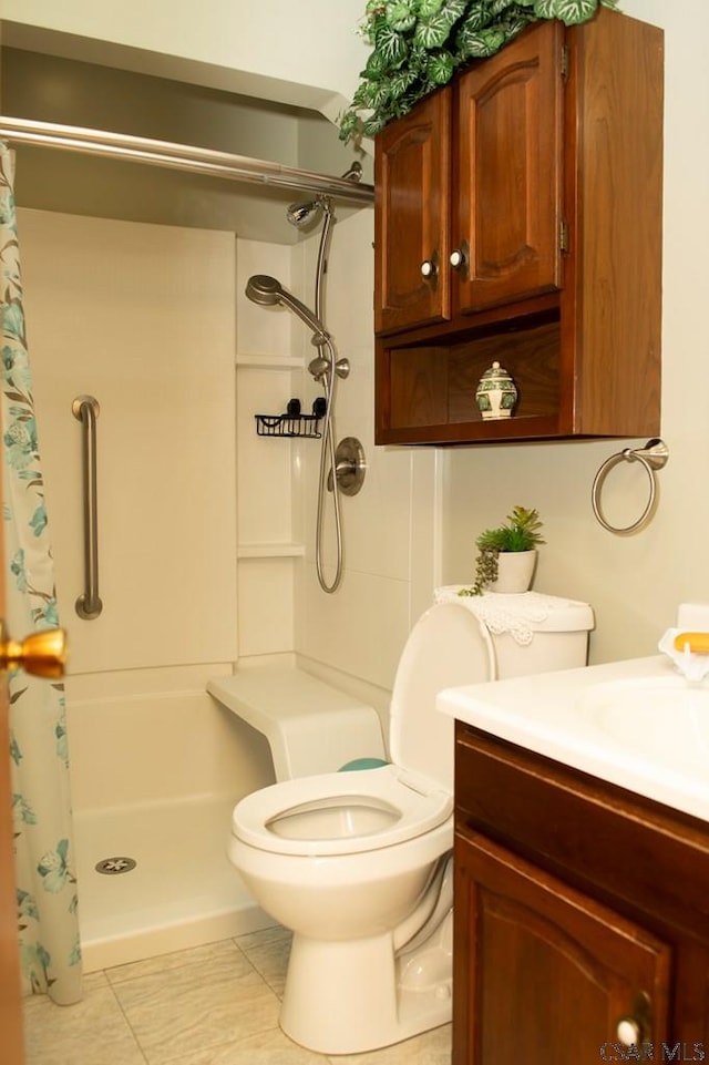 bathroom featuring vanity, toilet, tile patterned floors, and a shower with curtain