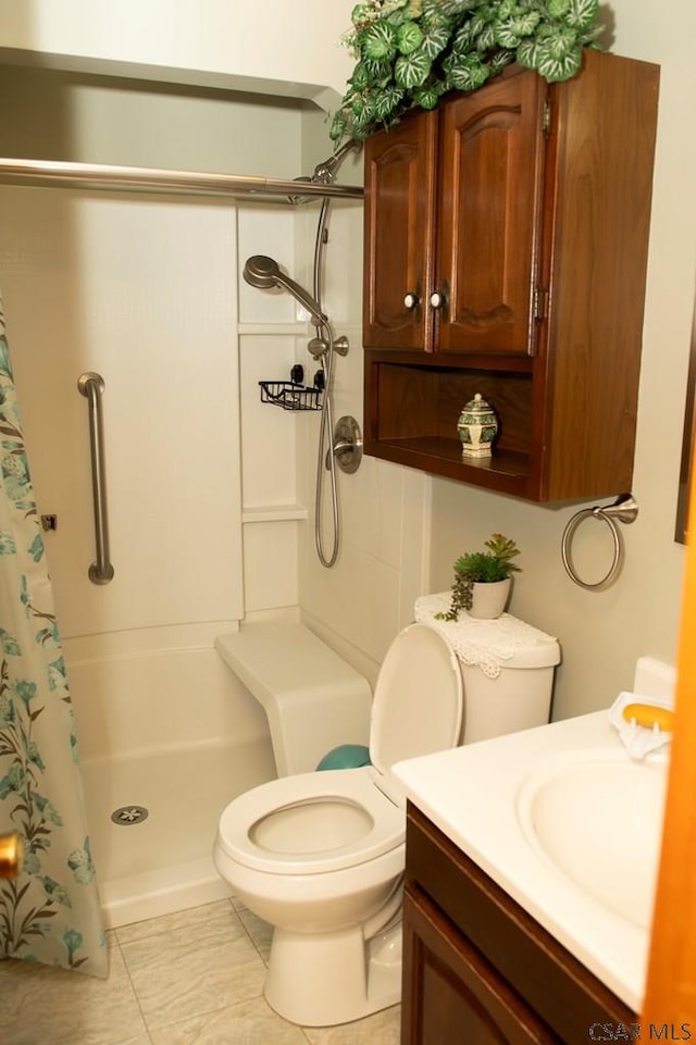 bathroom featuring walk in shower, vanity, and toilet