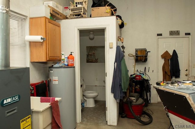 utility room with water heater