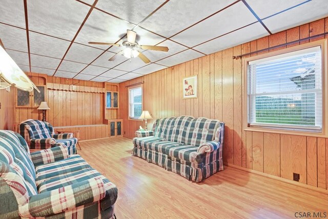 living room featuring hardwood / wood-style flooring and ceiling fan