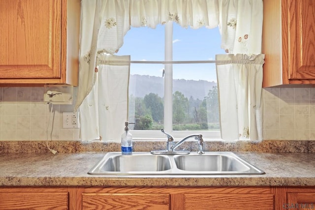 kitchen with plenty of natural light, sink, and decorative backsplash