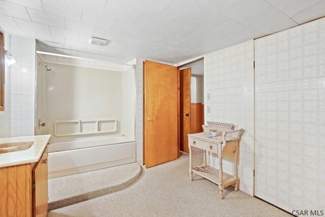 bathroom featuring vanity and shower / bathing tub combination