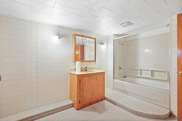 bathroom with vanity and washtub / shower combination