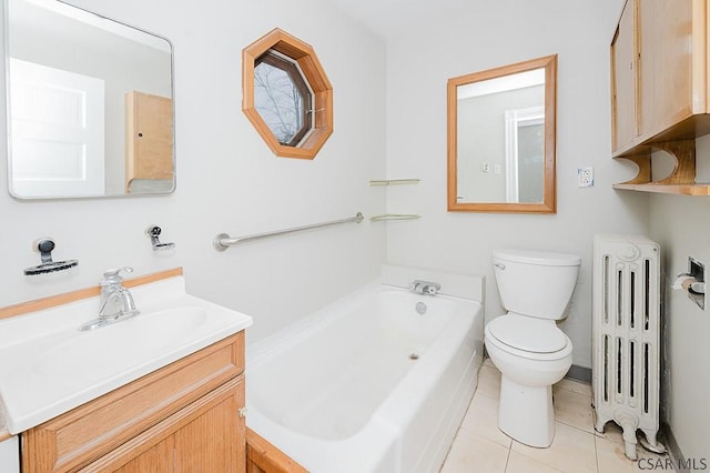 bathroom featuring radiator, toilet, vanity, tile patterned flooring, and a bath