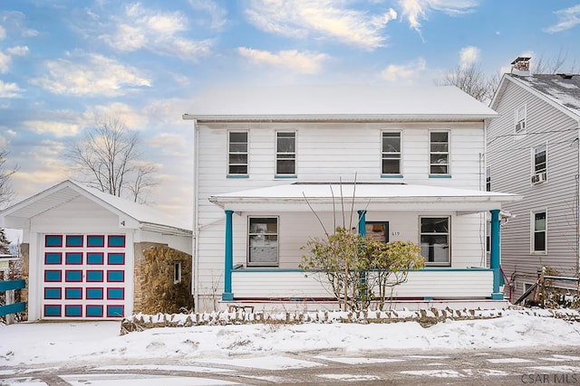 view of front of home featuring a porch and a garage