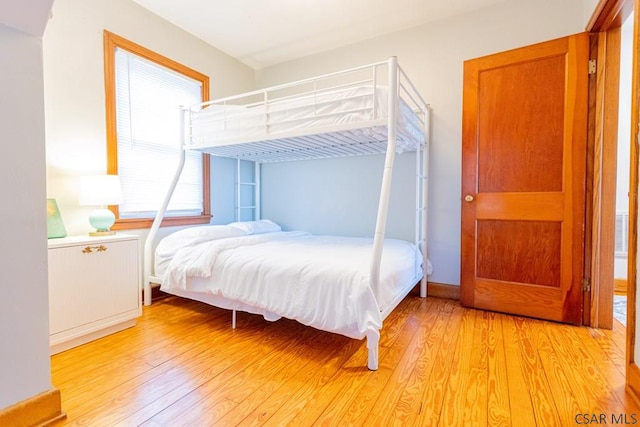 bedroom with light wood-style floors
