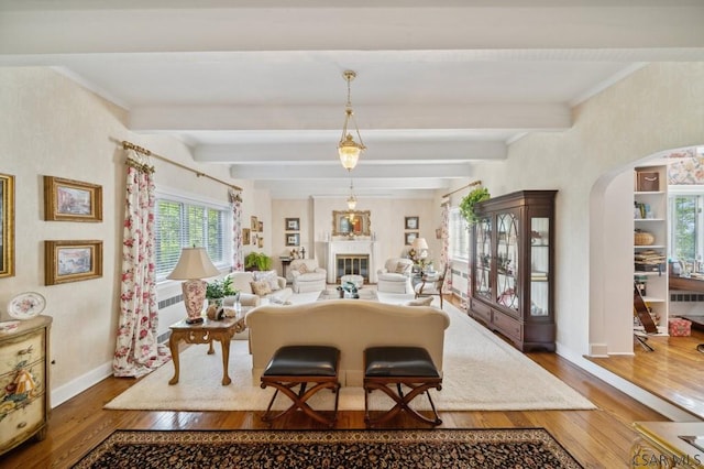 dining area with dark wood-type flooring and beamed ceiling