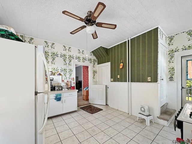 521 N Julian St, Ebensburg, PA 15931 - kitchen featuring white appliances, wallpapered walls, a ceiling fan, white cabinetry, and light tile patterned flooring