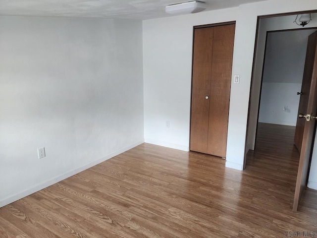 empty room featuring hardwood / wood-style flooring