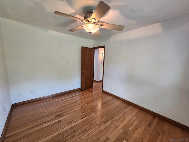 unfurnished room featuring hardwood / wood-style flooring and ceiling fan