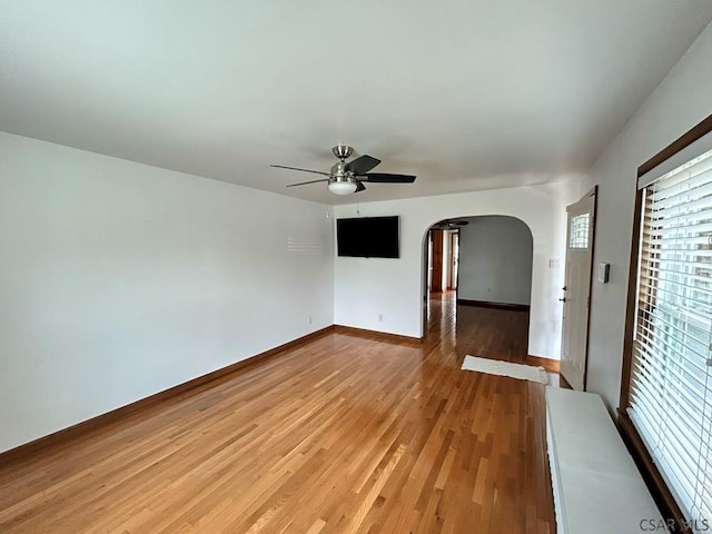 empty room featuring hardwood / wood-style flooring and ceiling fan