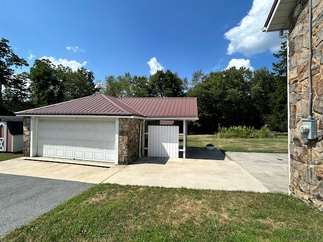 garage with a lawn