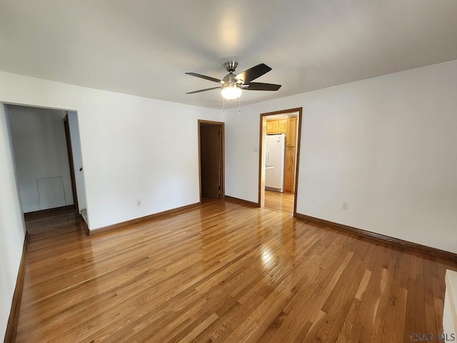 spare room with ceiling fan and light hardwood / wood-style flooring