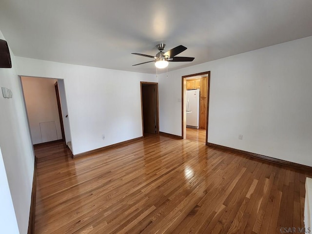 spare room with light hardwood / wood-style floors and ceiling fan