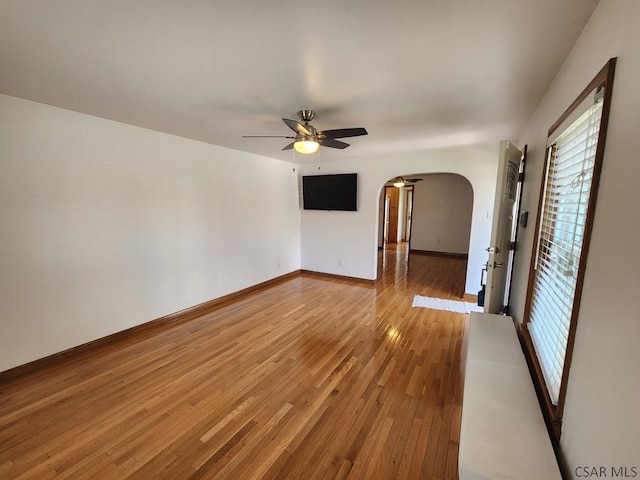 spare room featuring hardwood / wood-style flooring and ceiling fan