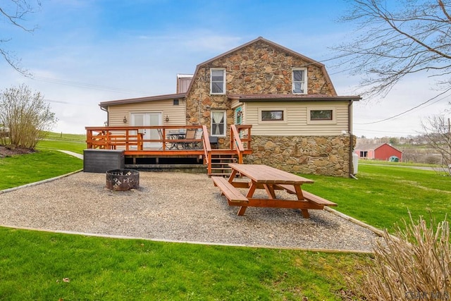408 Byers Rd, Somerset, PA 15501 - rear view of property with a lawn, stone siding, and a deck