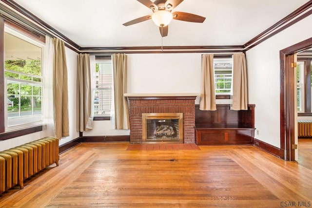 429 S Center Ave, Somerset, PA 15501 - unfurnished living room with radiator, wood finished floors, plenty of natural light, and ornamental molding