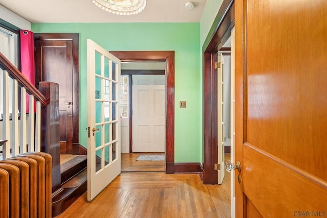 429 S Center Ave, Somerset, PA 15501 - foyer entrance featuring radiator heating unit, wood finished floors, french doors, and stairway