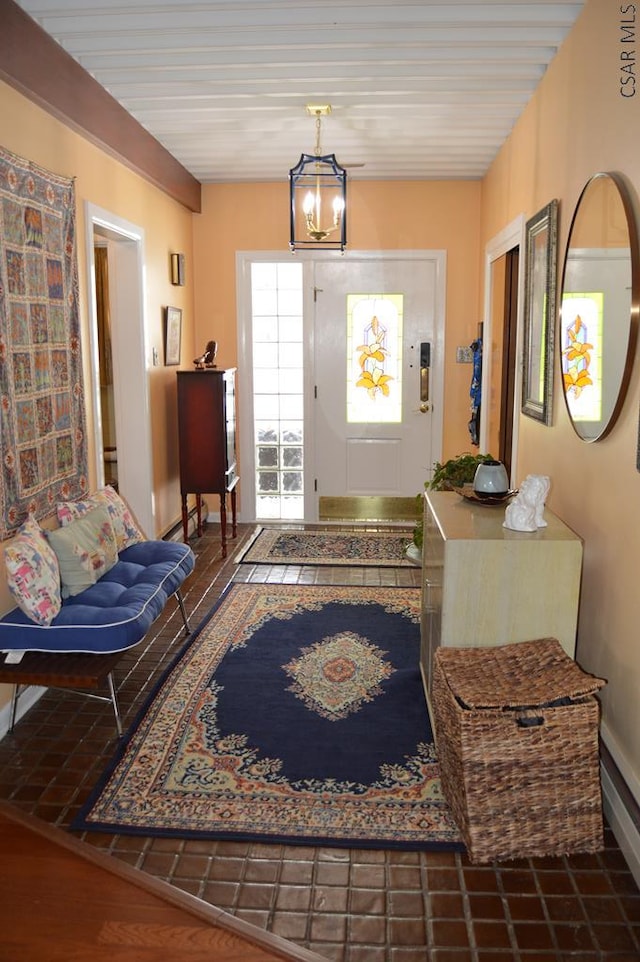 entryway with an inviting chandelier and hardwood / wood-style floors