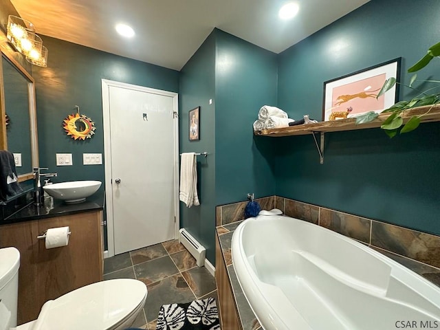 bathroom featuring vanity, tiled tub, toilet, and baseboard heating