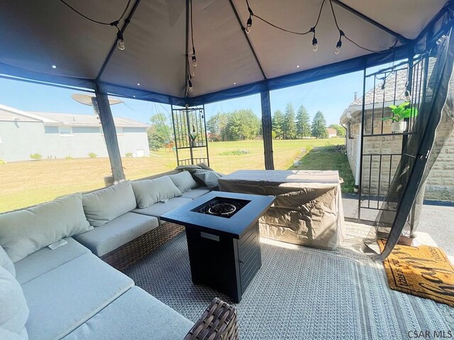 sunroom / solarium featuring rail lighting