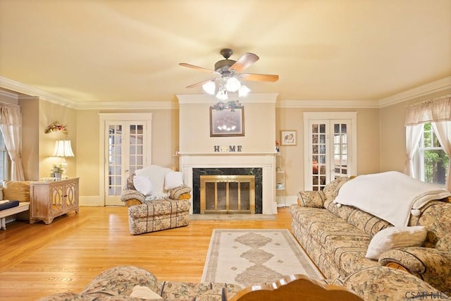 932 Luzerne St, Johnstown, PA 15905 - living area featuring french doors, ceiling fan, ornamental molding, wood finished floors, and a fireplace
