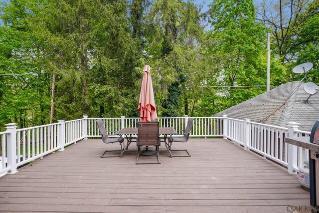 932 Luzerne St, Johnstown, PA 15905 - wooden terrace with outdoor dining space and view of wooded area