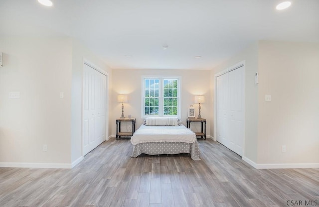 bedroom with light hardwood / wood-style flooring