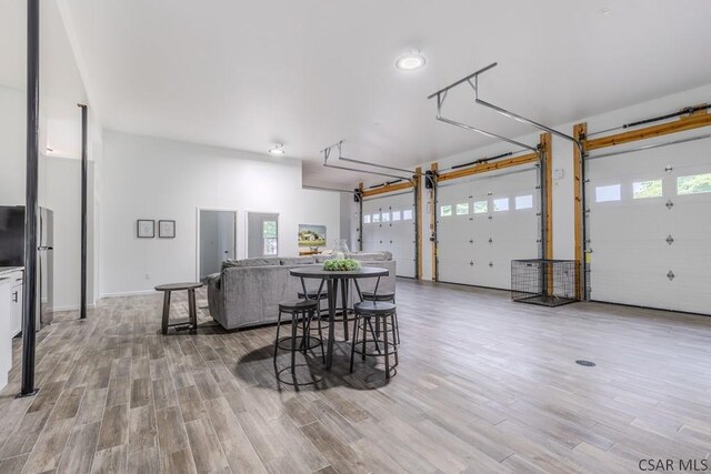 garage featuring stainless steel refrigerator