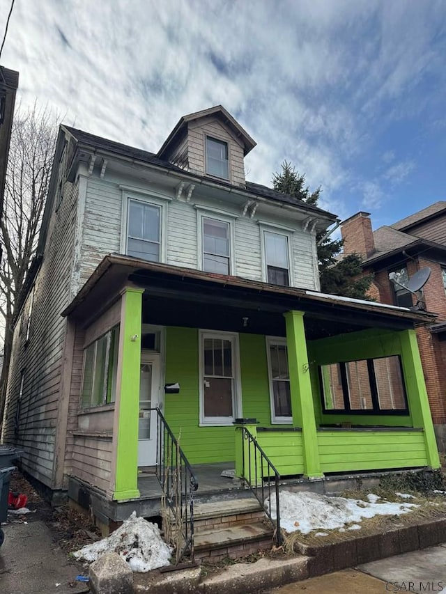 italianate-style house with a porch