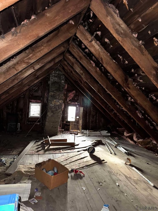 attic featuring a wealth of natural light