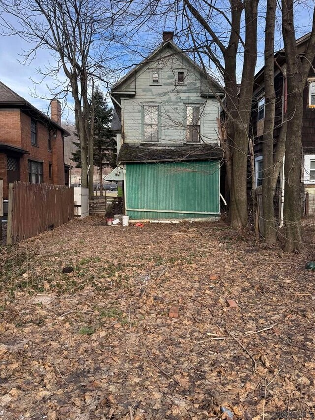 back of property with fence