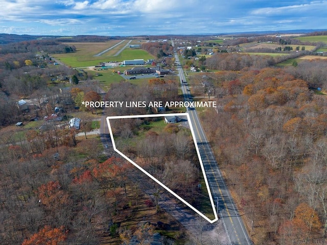 birds eye view of property featuring a rural view