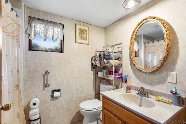 bathroom with vanity and toilet