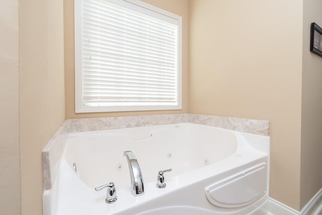 bathroom with a bath to relax in