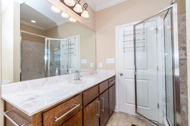 bathroom with an enclosed shower, tile floors, ornamental molding, and vanity