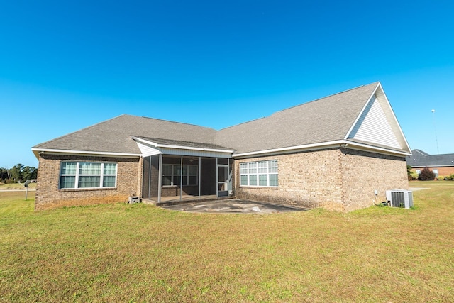 back of house featuring a lawn, central AC, a patio area, and a sunroom