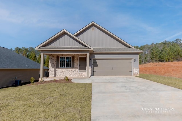 craftsman inspired home with central AC unit, a front lawn, and a garage