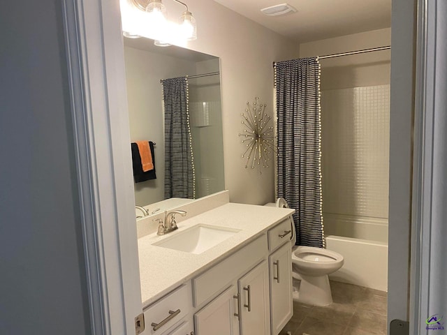 full bathroom featuring tile flooring, toilet, shower / bath combo, and vanity with extensive cabinet space