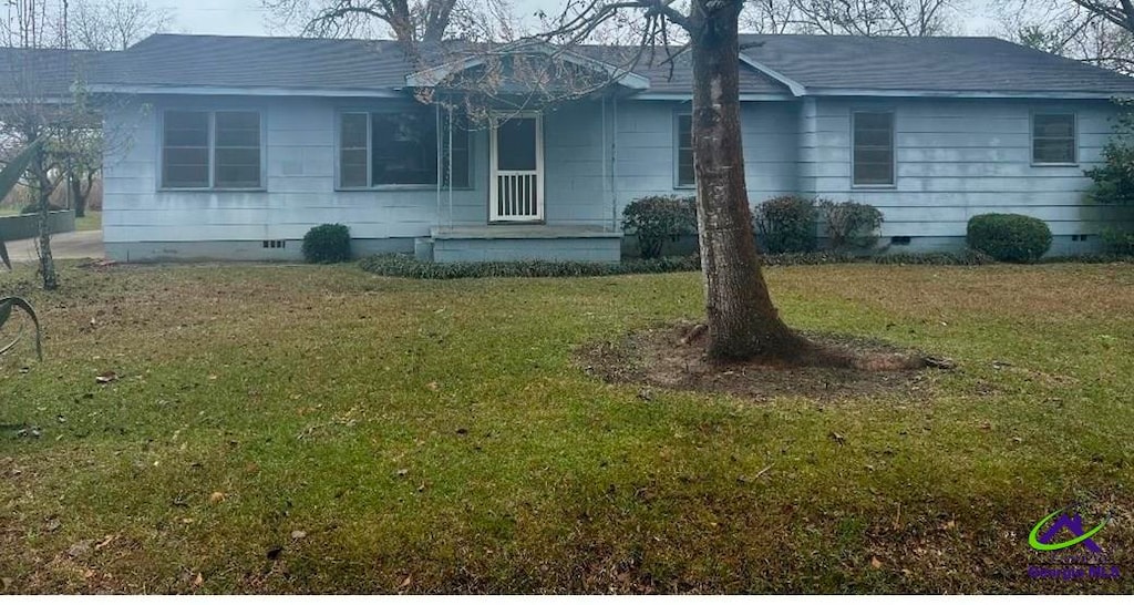 view of home's exterior with a lawn