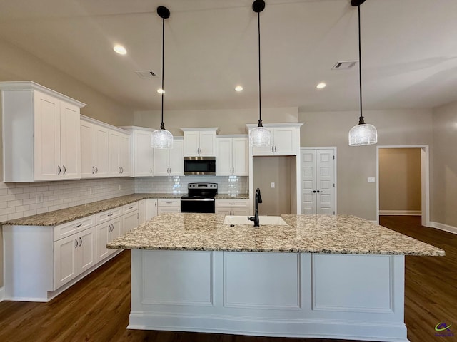 kitchen with appliances with stainless steel finishes, a sink, visible vents, and white cabinets