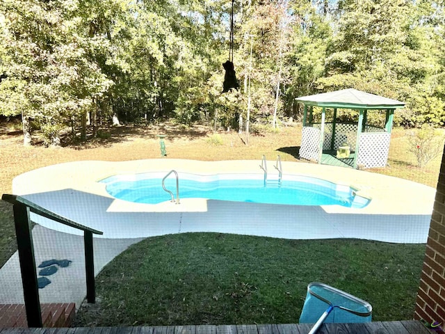 2382 Gallimore Mill Rd, Jeffersonville, GA 31044 - view of swimming pool with a yard, a gazebo, and view of wooded area