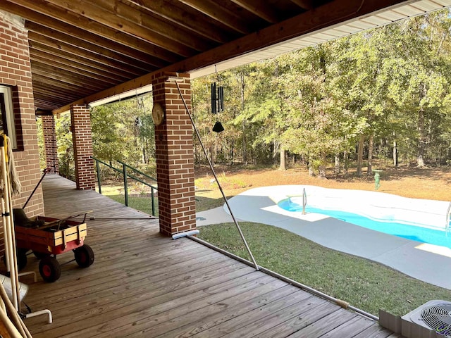2382 Gallimore Mill Rd, Jeffersonville, GA 31044 - deck with an outdoor pool and a patio