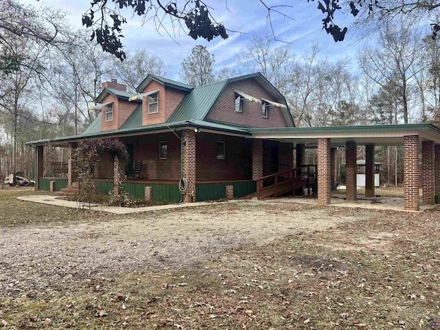 2382 Gallimore Mill Rd, Jeffersonville, GA 31044 - view of front of home with covered porch, brick siding, and a chimney
